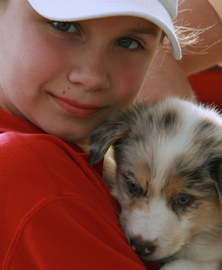 child-with-new-puppy-by-Big-Gey-Mare.jpg