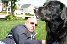 jim-with-tenor-dog-in-front-yard.jpg