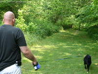 poop-patrol-dog-waste-bag-holder-on-flexi-leash.jpg