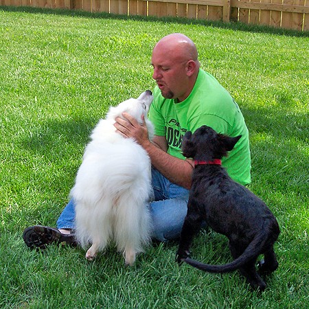 Jim playing with Jersey and Destin in the backyard.