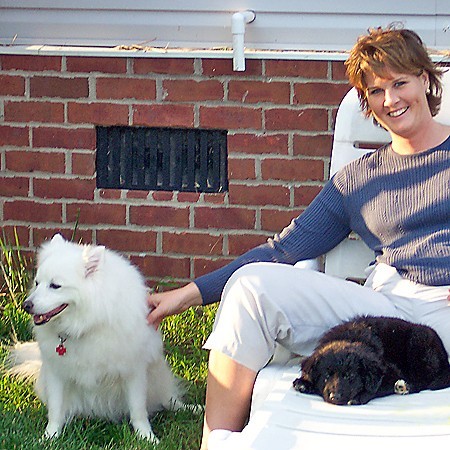 Lynnette with Jersey and Destin in the backyard.