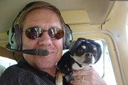 pilot-with-dog-wearing-mutt-muffs.jpg