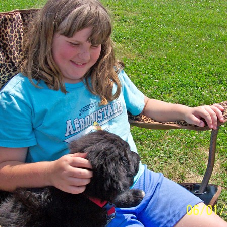 Destin loves playing with Sean's daugher, Shelby at the softball games.