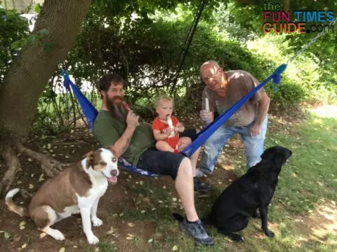 This is my father-in-law, husband, son, and dogs relaxing in the backyard.